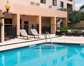 Refreshing outdoor pool at Courtyard Miami Dolphin Mall.