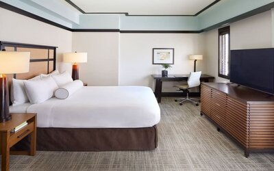 Spacious delux king room with TV and business desk at The Ambrose Hotel Santa Monica.