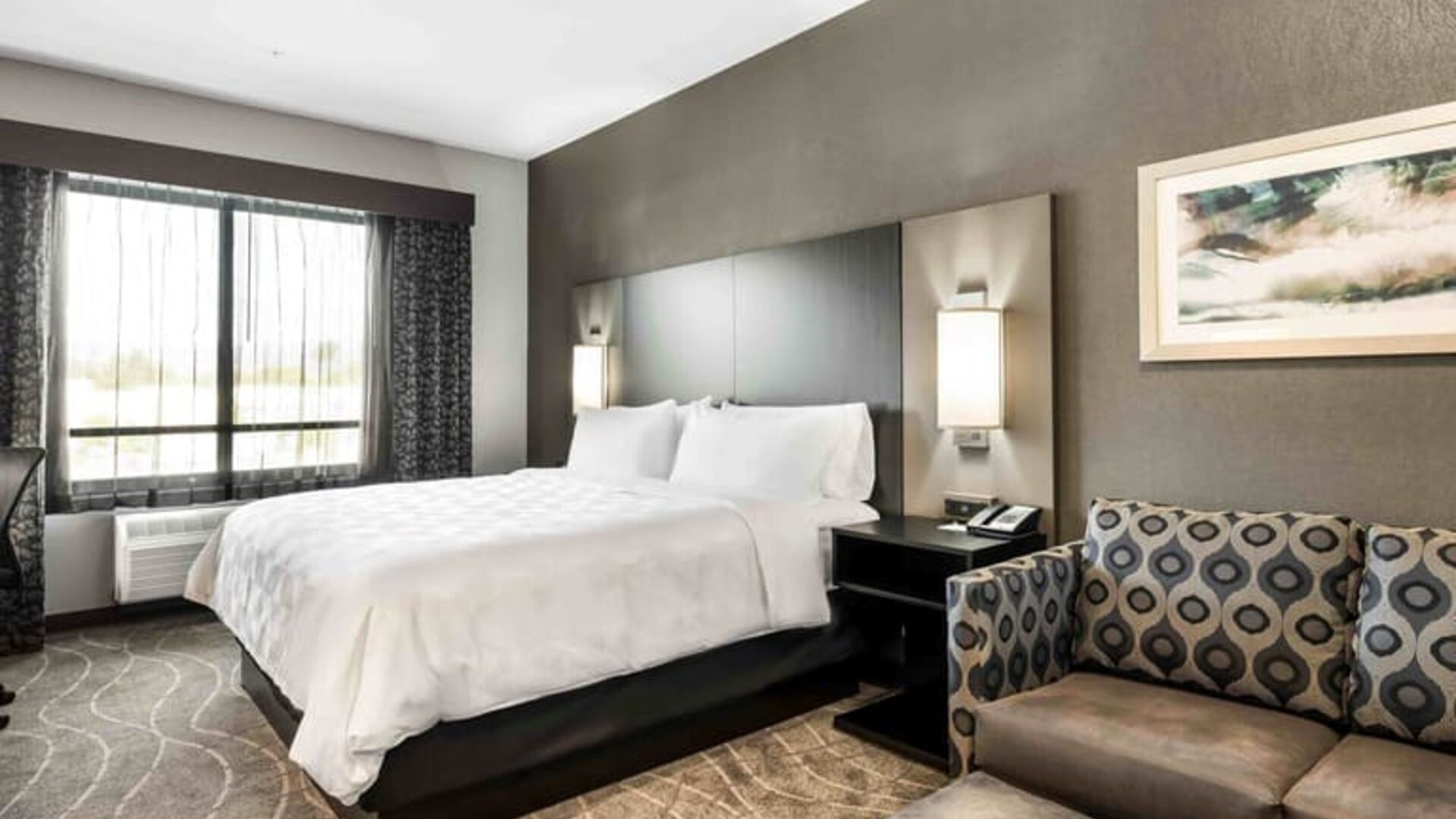 Day use room with sofa at Holiday Inn & Suites Silicon Valley - Milpitas.