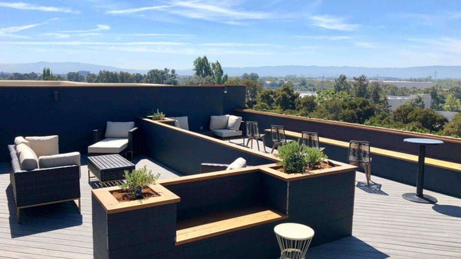 Rooftop outdoor furniture at Holiday Inn & Suites Silicon Valley - Milpitas.