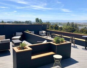 Rooftop outdoor furniture at Holiday Inn & Suites Silicon Valley - Milpitas.