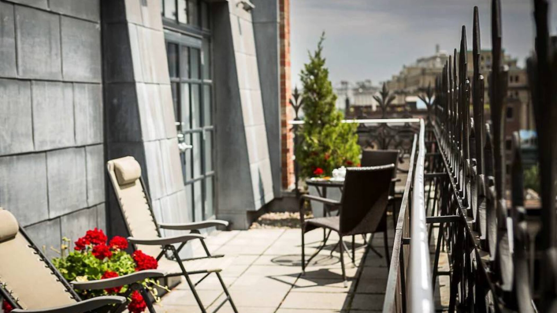Many of the rooms in Hotel Gault have balconies with chairs and tables.