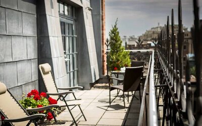 Many of the rooms in Hotel Gault have balconies with chairs and tables.