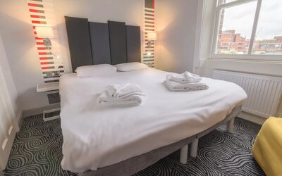 Zoomed in view of the king size bed in the guest suite room at the Victoria Inn, London, UK.