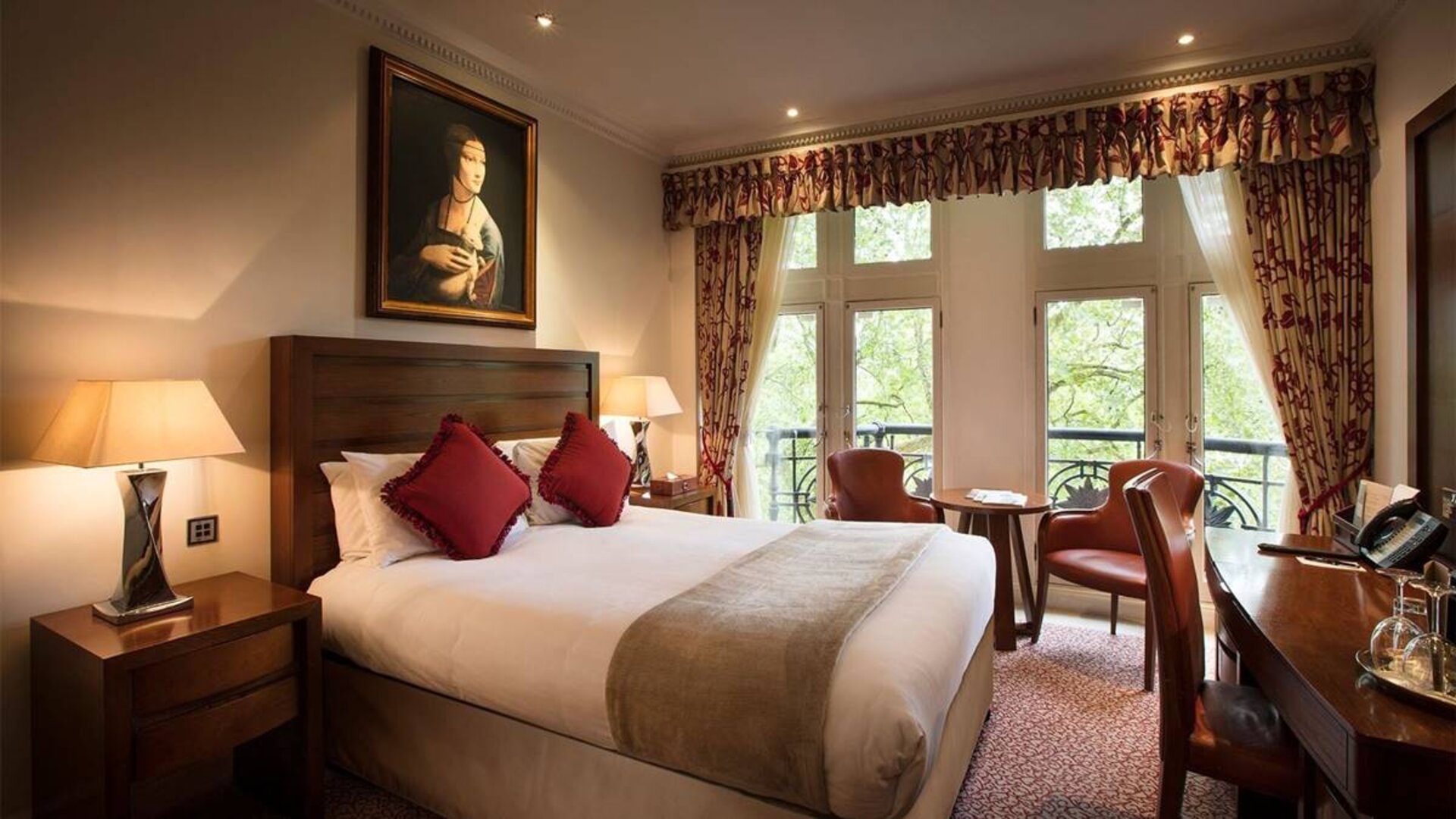 The Royal Horseguards Hotel’s garden view double room, with large windows for a verdant view.