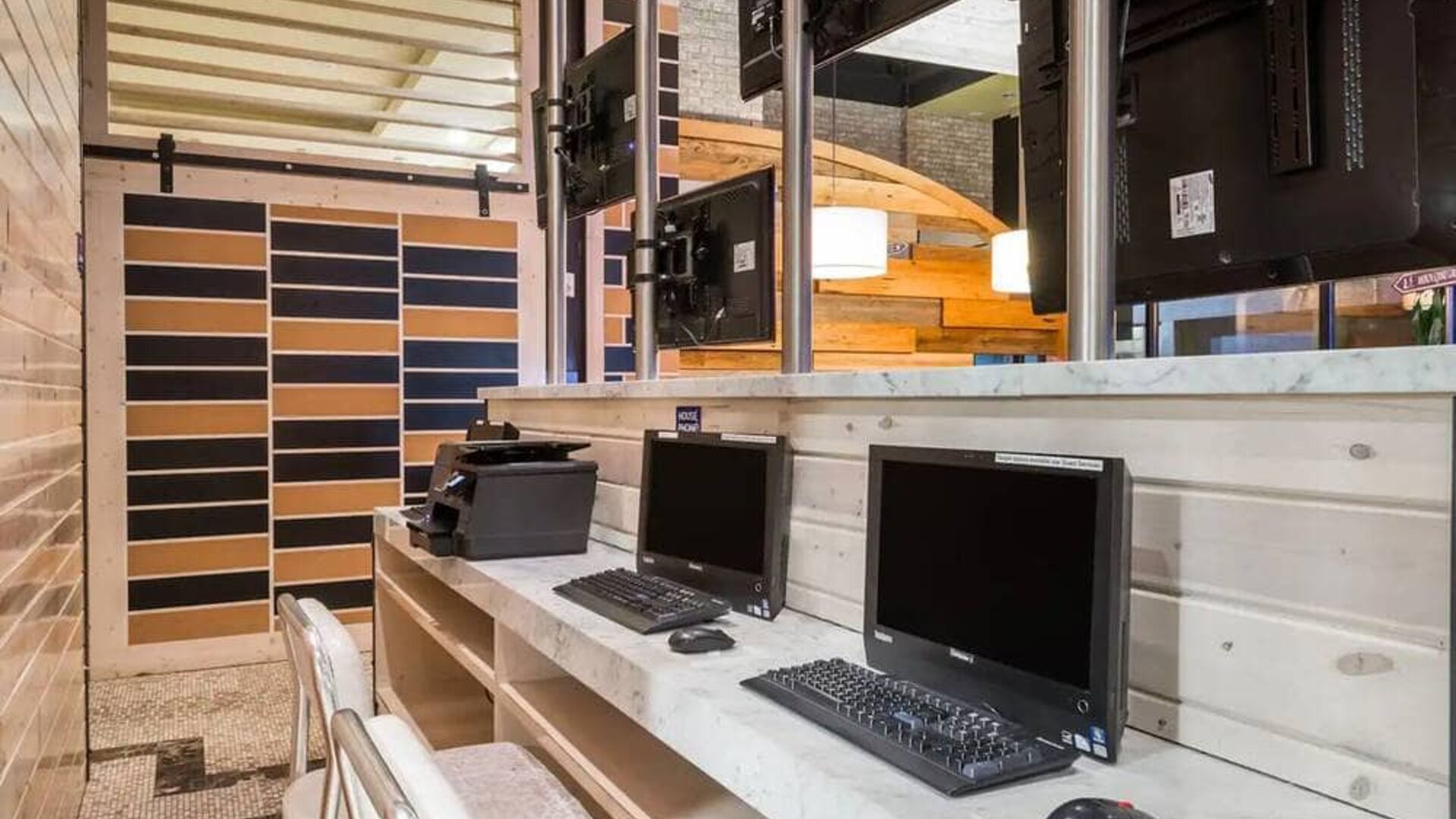 The hotel’s business center, with multiple workstations and office equipment.