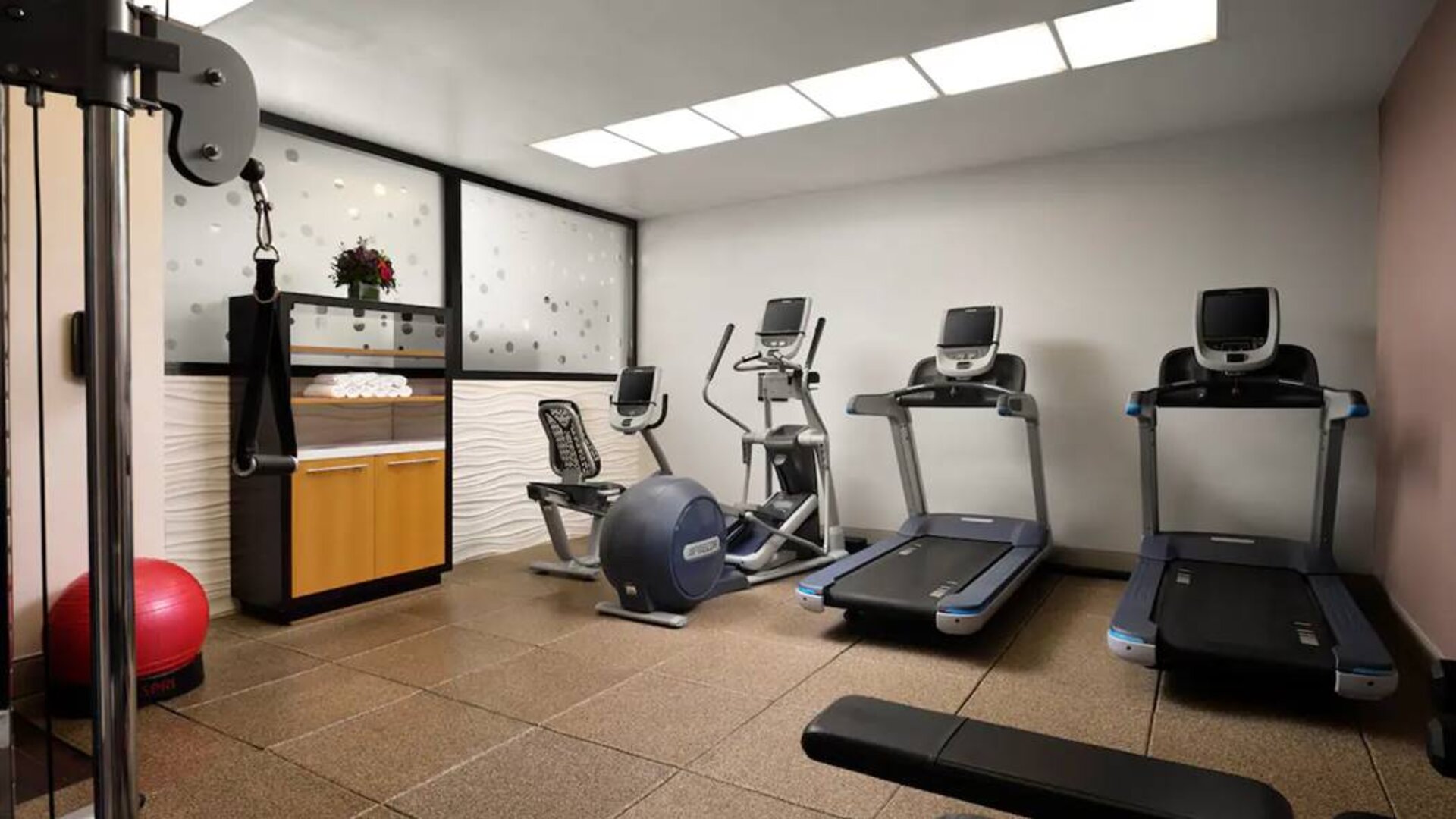 The hotel’s fitness center, equipped with a range of exercise machines.
