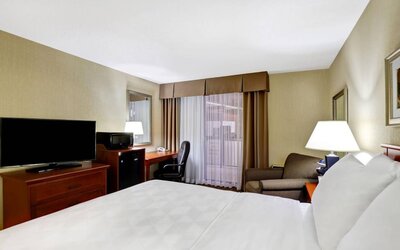 Guest room in Holiday Inn Laval Montreal, featuring workspace desk and chair.