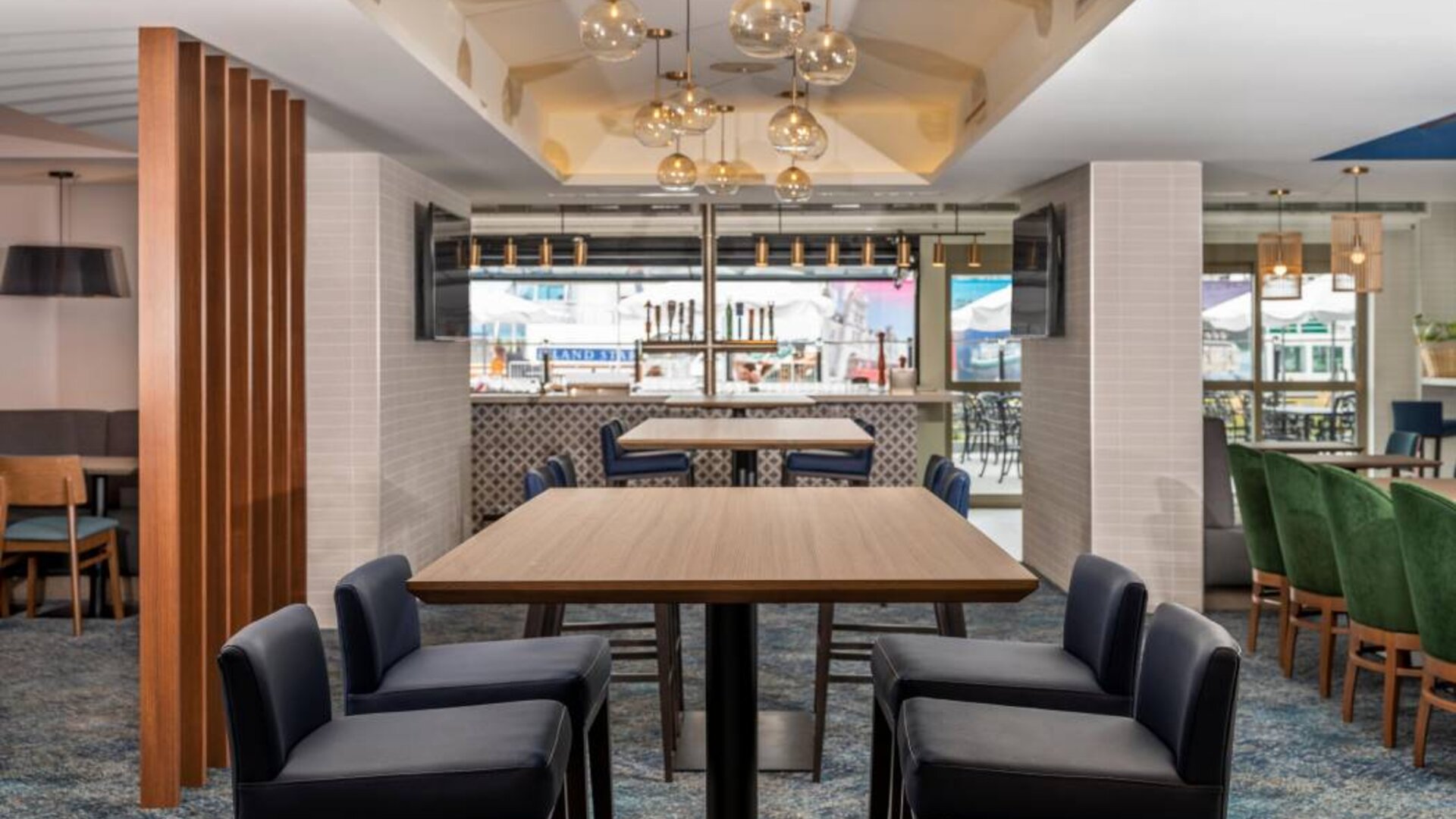 The on-site restaurant has both indoor and outdoor tables, and a bar.