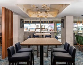 The on-site restaurant has both indoor and outdoor tables, and a bar.