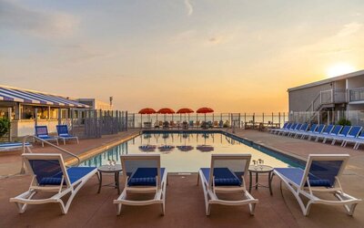 Stunning outdoor pool at sunset at Sea Crest Beach Hotel.