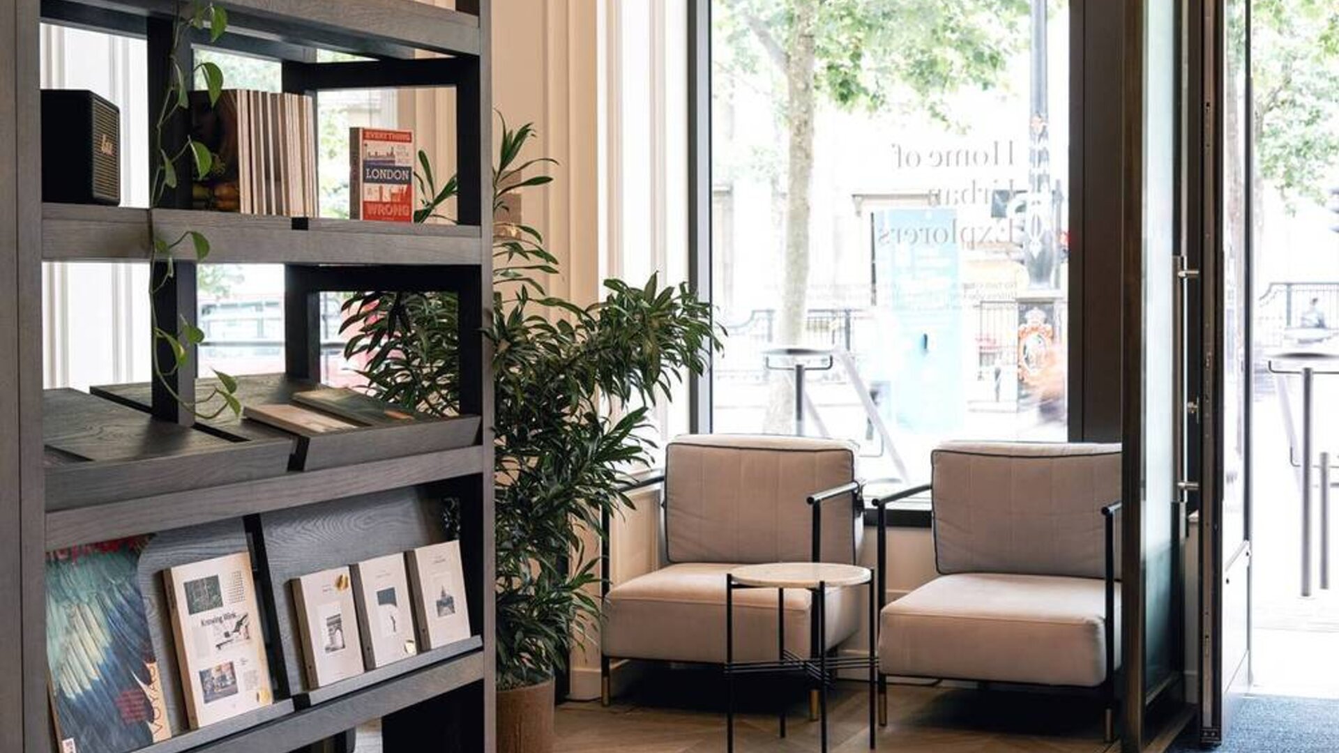 The Page Common Coffeehouse of Page8, Page Hotels with large windows and comfy seating for social discourse.