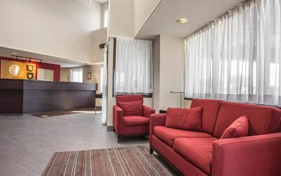 The hotel’s lobby has comfortable seating for guests to socialize and relax.