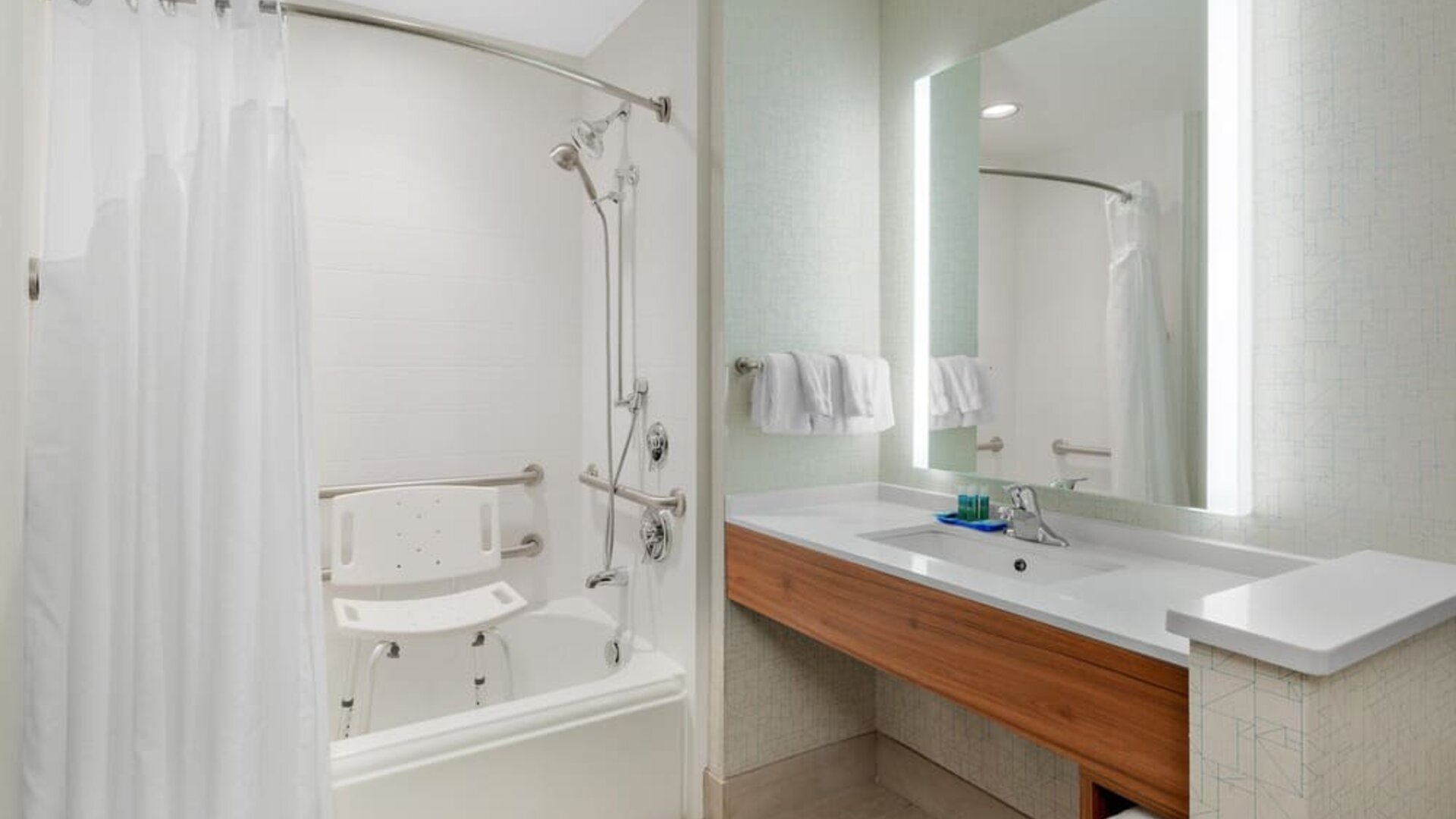 Private guest bathroom with shower at Holiday Inn Express & Suites Ontario.