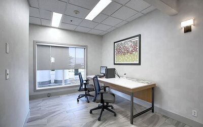 Dedicated business center with PC, internet, printer, and work space at Holiday Inn Express & Suites Airport-Calgary.