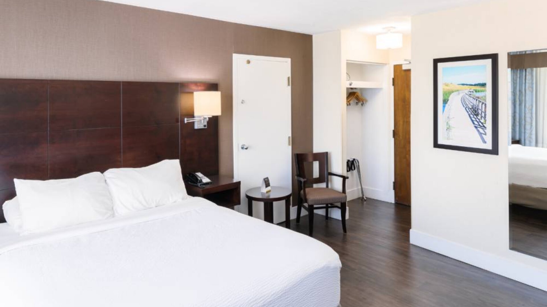 Double bed guest room in Rodd Royalty, including chair and coffee table.