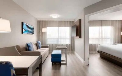 Comfortable living area in a king suite at the Embassy Suites by Hilton Toronto Airport.