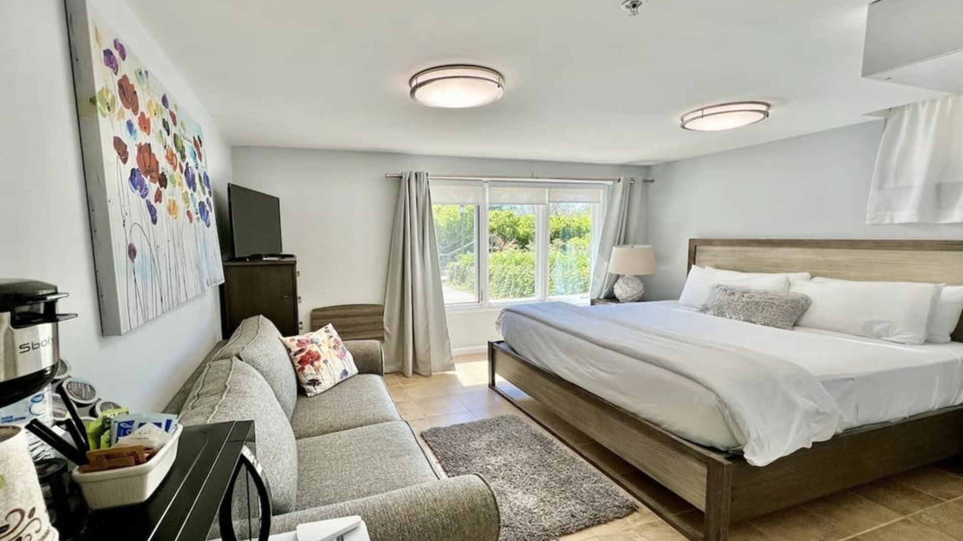 Comfortable delux king with couch at Skylaranna Hotel and Resort.