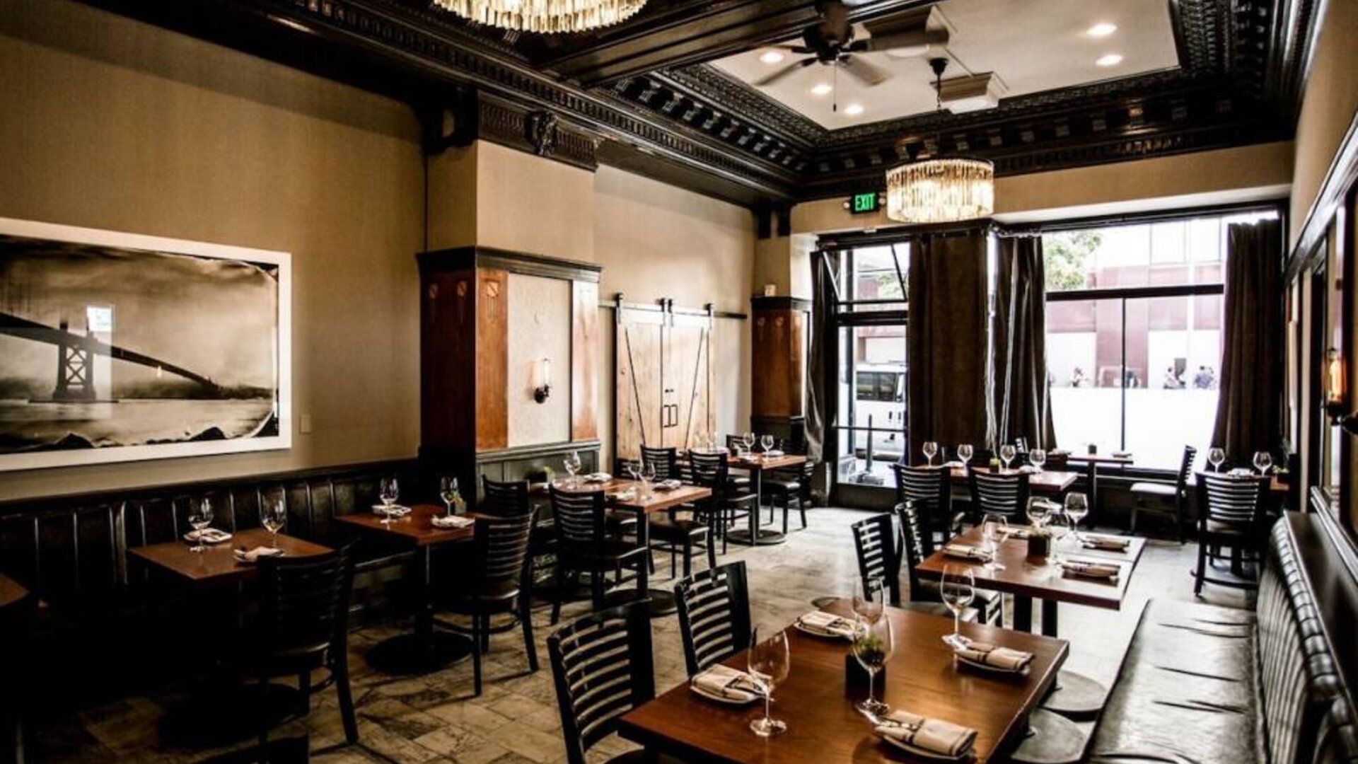 The hotel’s adjoining restaurant offers tables for two or four diners in a stylish, well-lit setting.