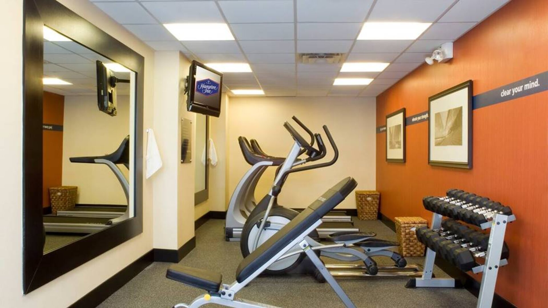 The hotel fitness room, which has rows of weights and assorted exercise machines.