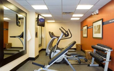The hotel fitness room, which has rows of weights and assorted exercise machines.