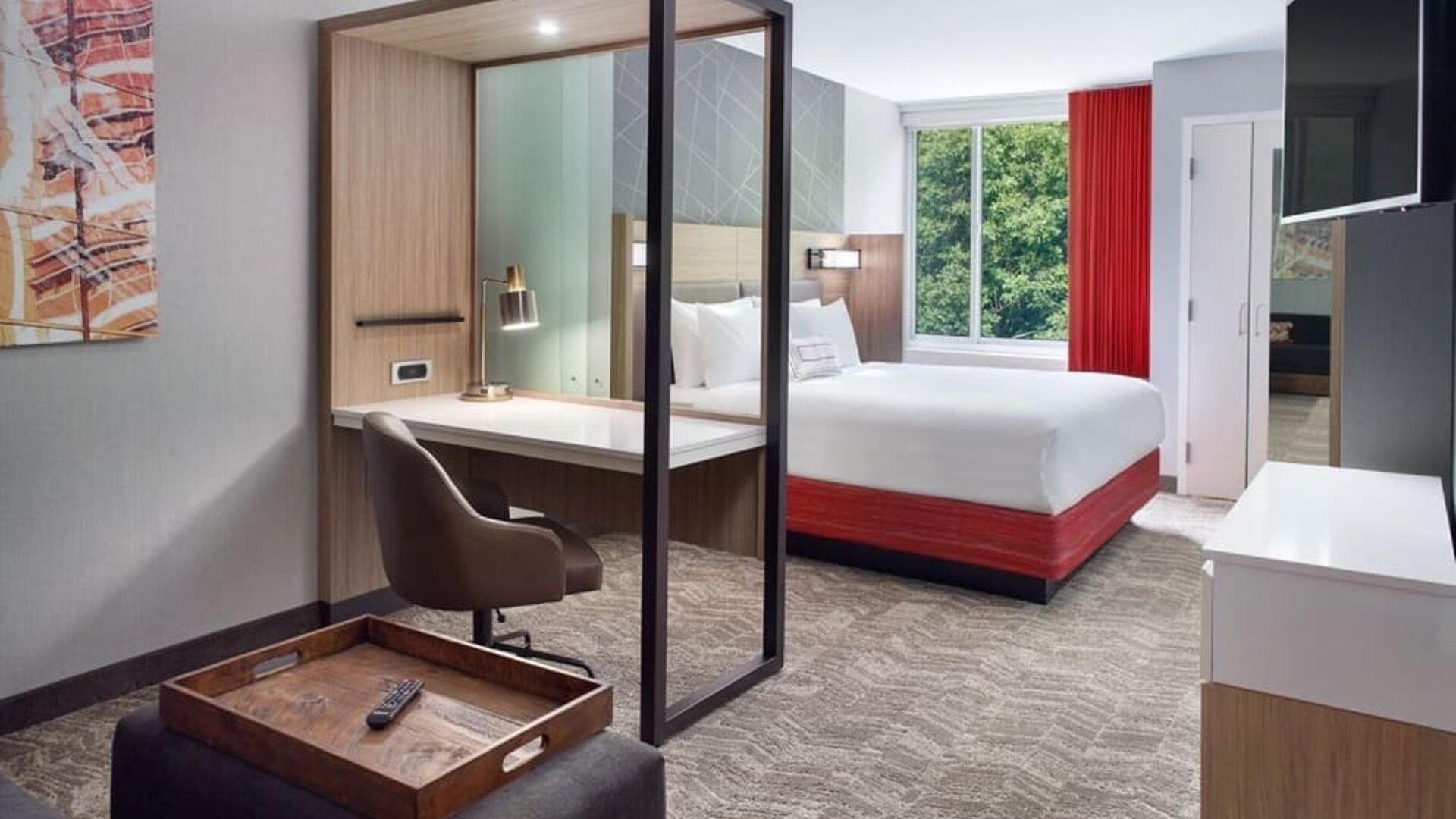 Spacious king room with TV and business desk at SpringHill Suites Atlanta Northwest.