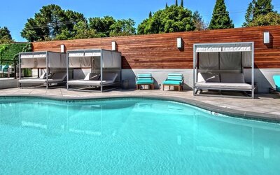Relaxing pool area with cabanas at Hampton Inn Vallejo.