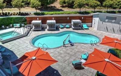 Stunning outdoor pool with sun beds at Hampton Inn Vallejo.
