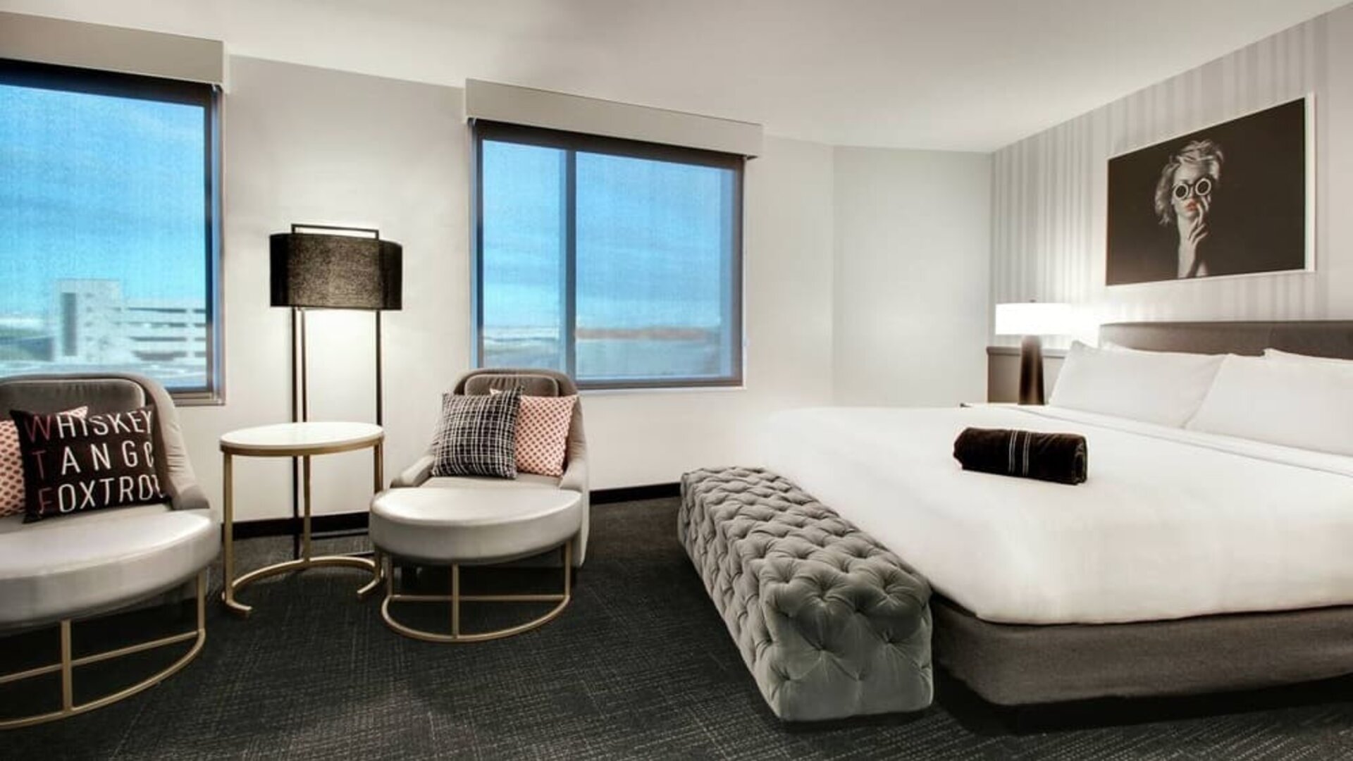 Spacious king bed with natural light at The Rose Hotel Chicago O’Hare, Tapestry Collection By Hilton.