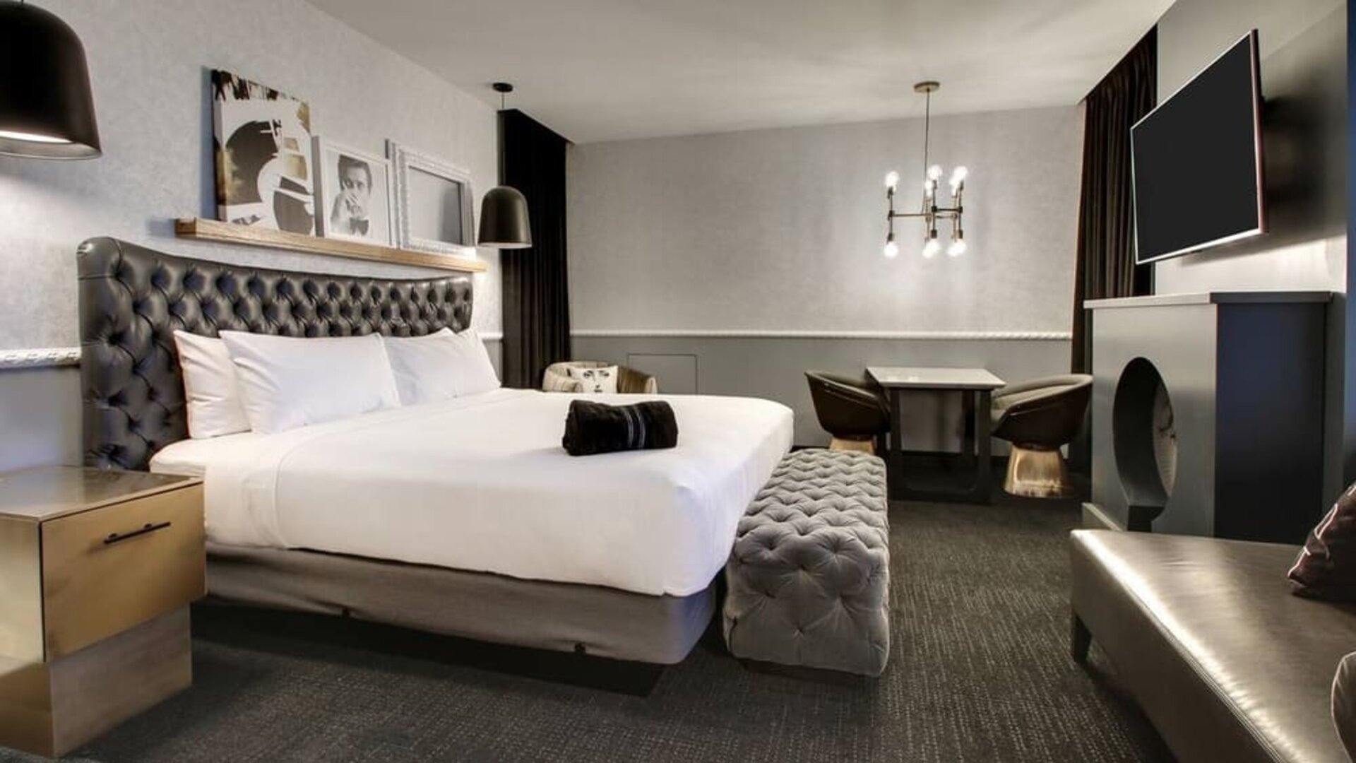 Spacious delux room with TV and seating area at The Rose Hotel Chicago O’Hare, Tapestry Collection By Hilton.