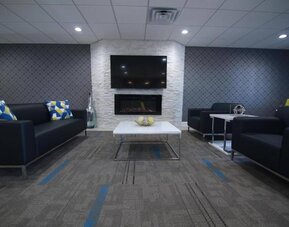 Lobby and coworking lounge at Home Inn & Suites.