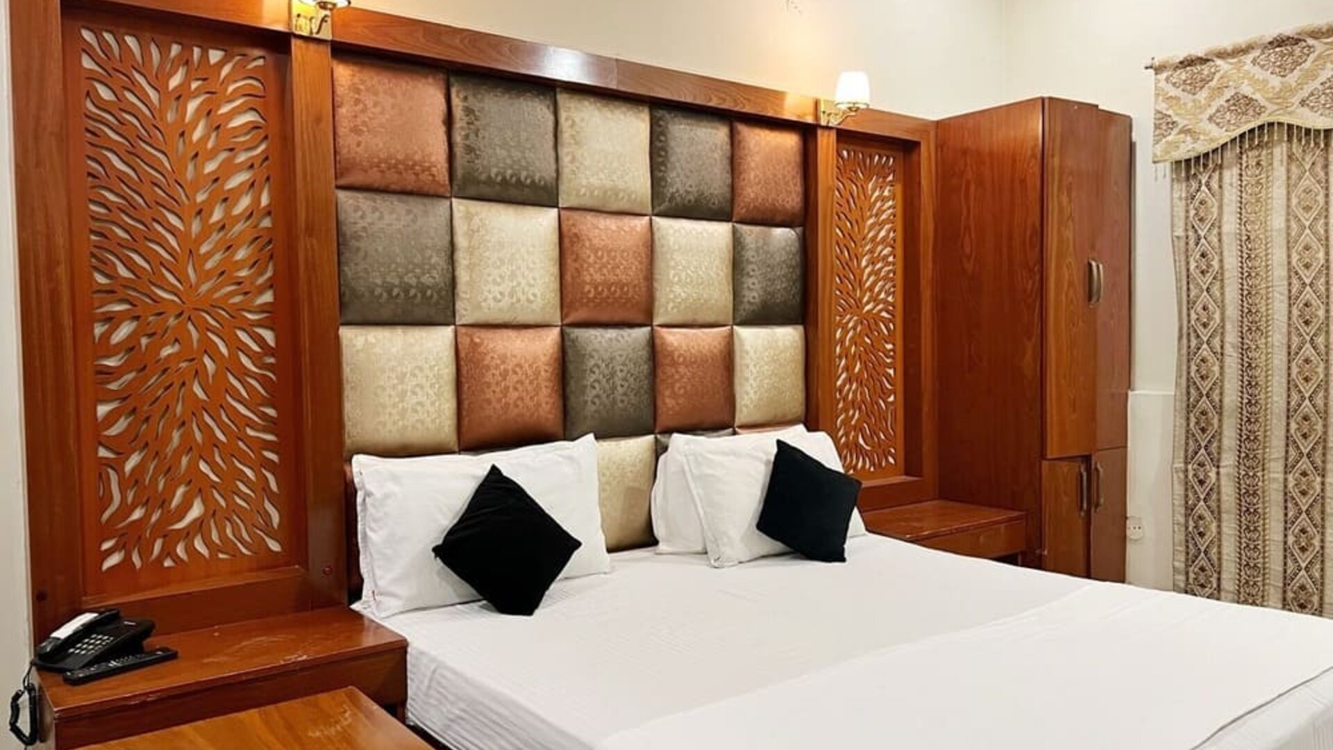 Comfortable delux king room at The Grand Hotel Multan.