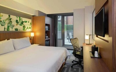 Double bed guest room at the Hilton Garden Inn New York Central Park South Mid-town West, with adjoining patio.