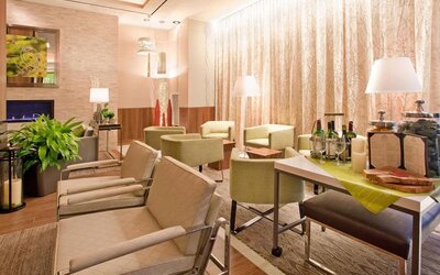 The lounge in the hotel’s reception area, with comfortable seating and small tables.