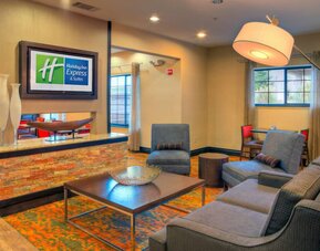 Lobby and coworking lounge at Holiday Inn Express Granbury.