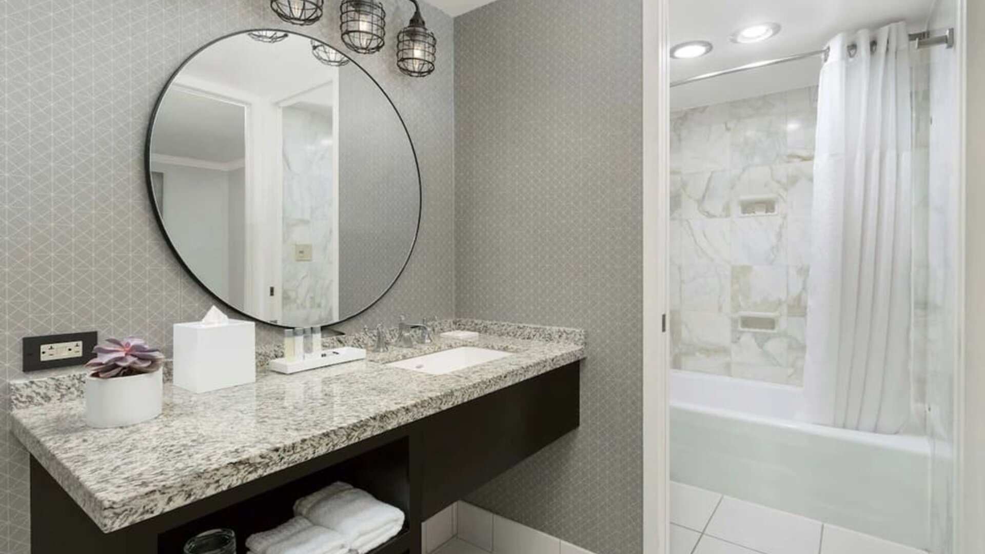 Private guest bathroom with bath and shower at Stanford Court San Francisco.