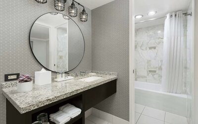 Private guest bathroom with bath and shower at Stanford Court San Francisco.