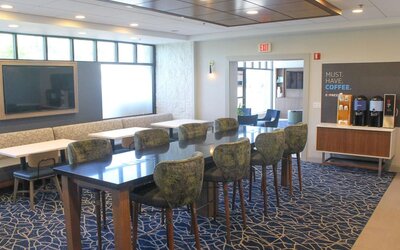 Dining and coworking space at Holiday Inn Express & Suites Boston-Cambridge.