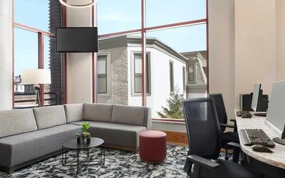 Dedicated business center with PC, internet, and work desks at Homewood Suites by Hilton University City.