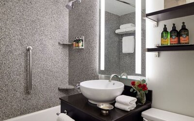Private guest bathroom with shower and bath at Capitol Hill Hotel.