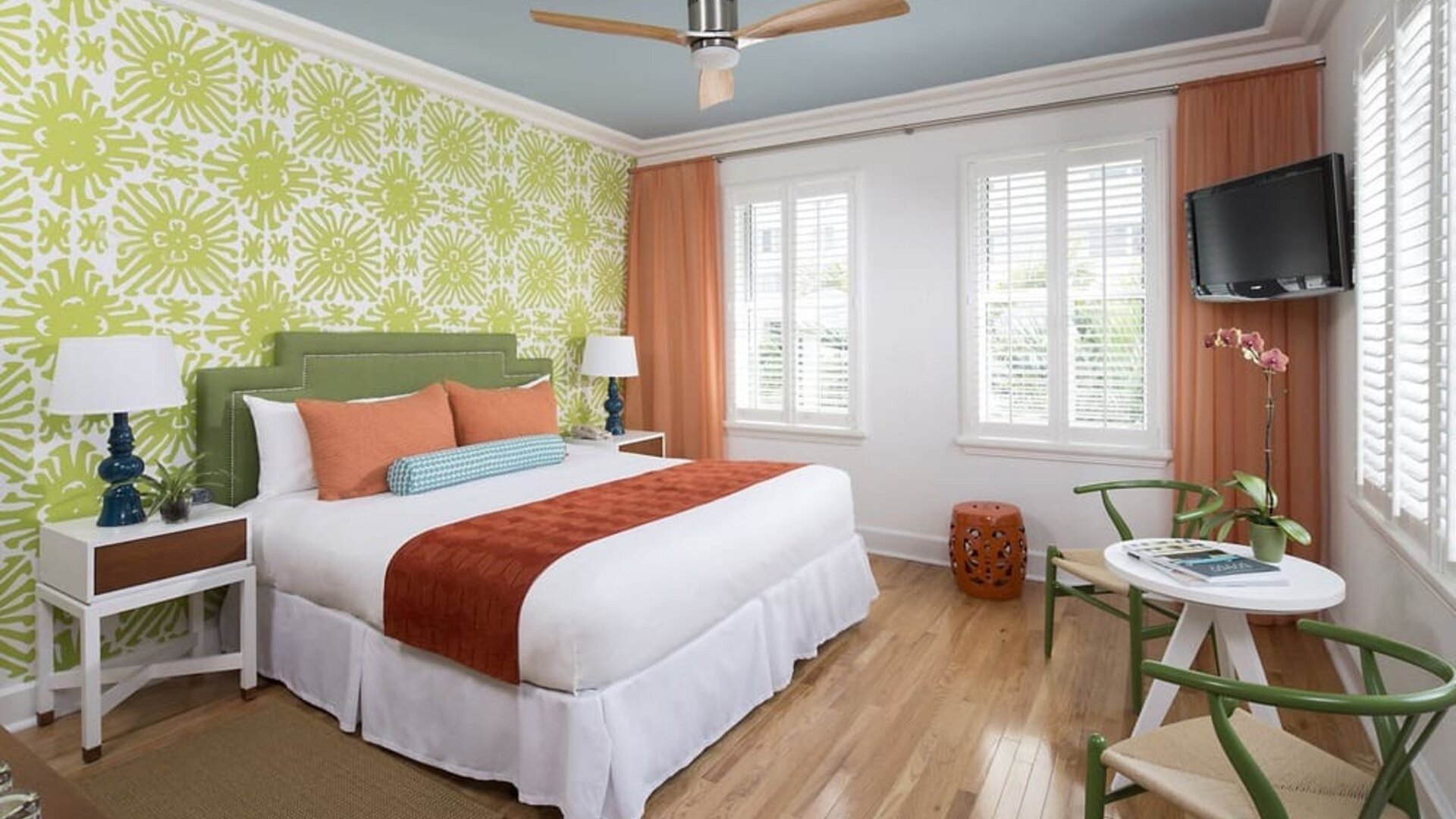 Delux king bed with TV and natural light at Circa 39 Hotel.