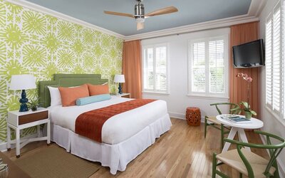 Delux king bed with TV and natural light at Circa 39 Hotel.