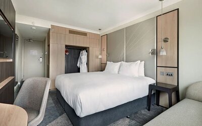 Delux king room with TV and desk at Hyatt Place London Heathrow Airport.