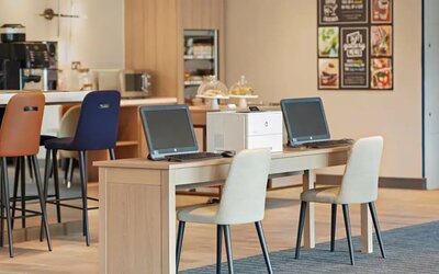 Business center with PC, internet, and printer at Hyatt Place London Heathrow Airport.