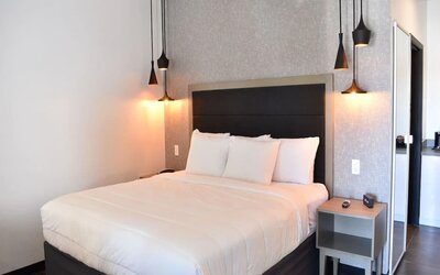 King bedroom with private bathroom at Hotel Bella.