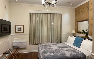 Day use room with TV and air conditioning at Parc Suites Hotel.