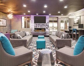 Lobby and coworking lounge at La Quinta Inn & Suites Cleveland Airport West.