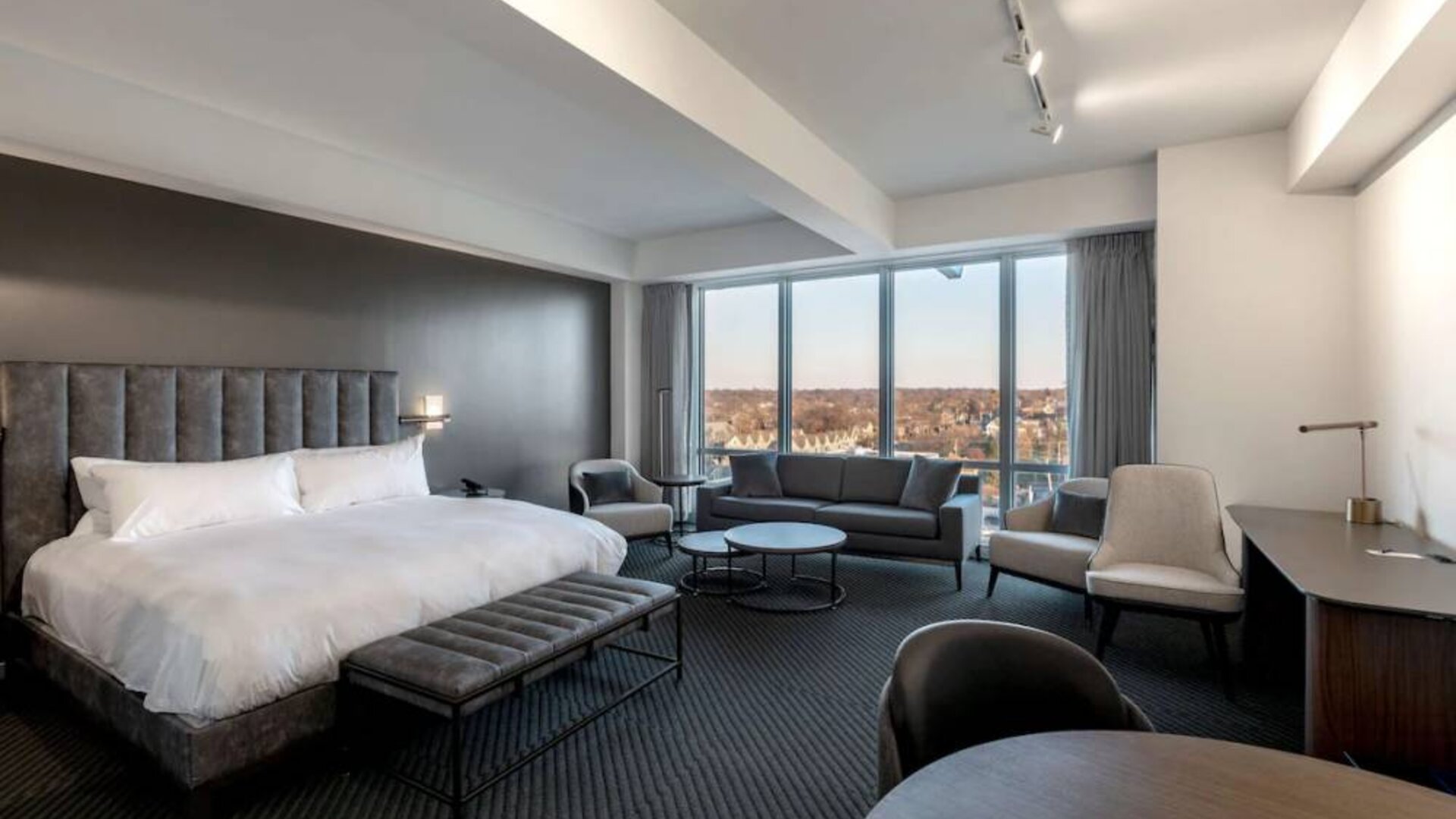 Day use room with sofa, work desk and dining table at Hotel Chauncey.
