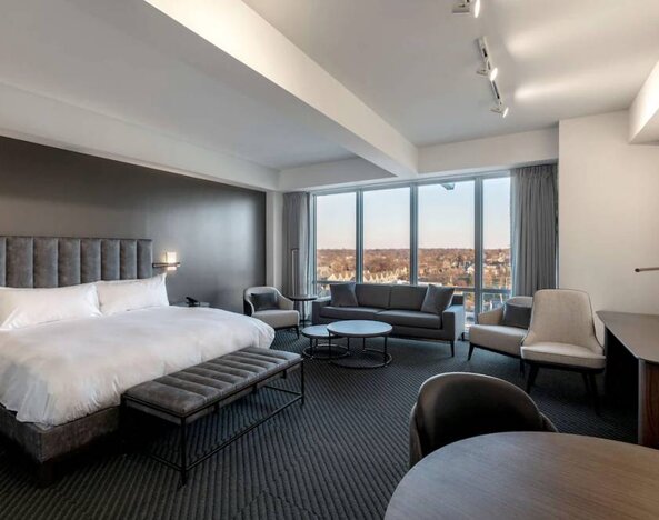 Day use room with sofa, work desk and dining table at Hotel Chauncey.
