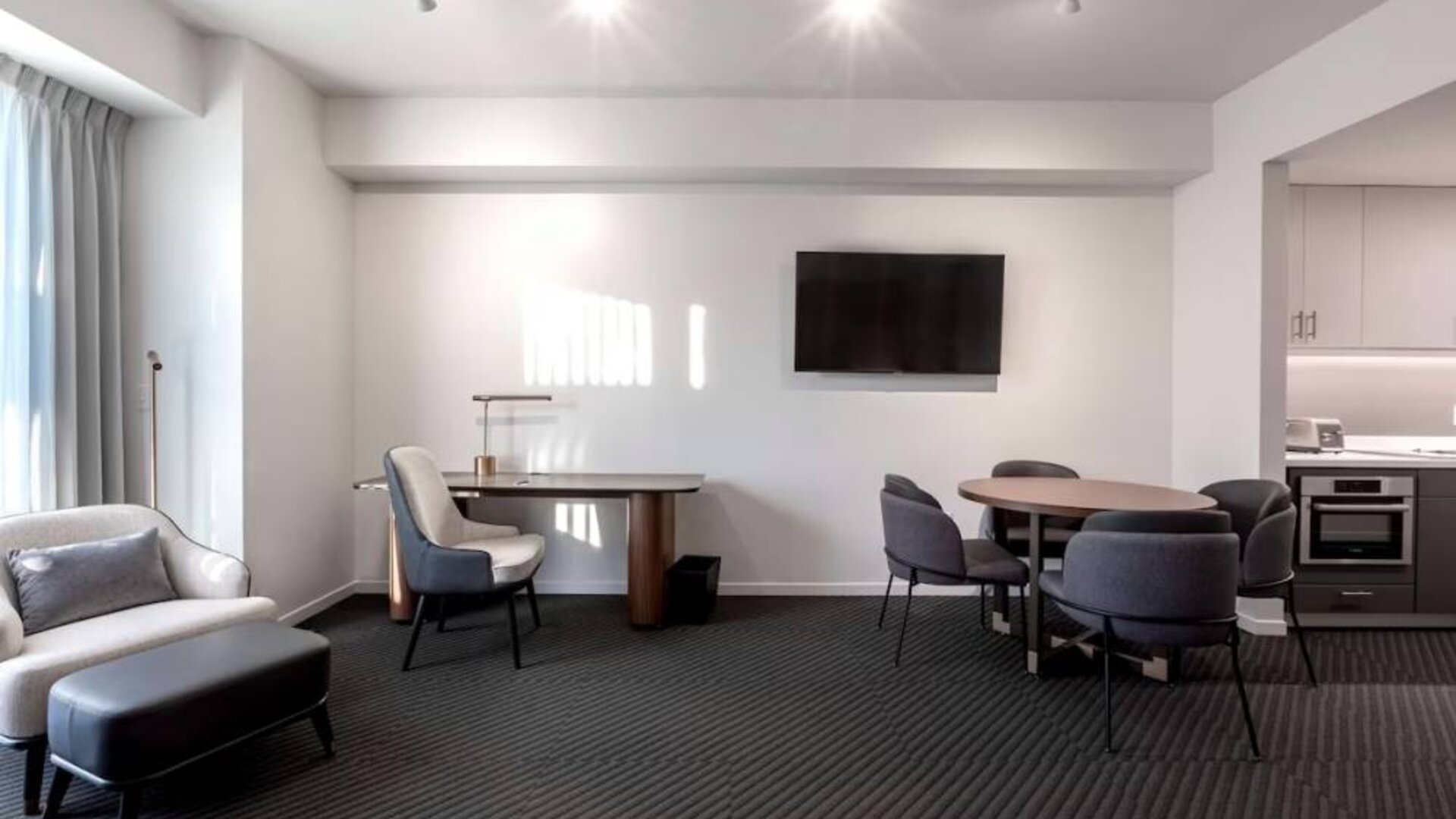 Workspace and dining table inside day use room at Hotel Chauncey.